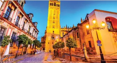  ??  ?? Quaint: The Giralda bell tower in Seville, Spain, where post-Brexit travel is much the same