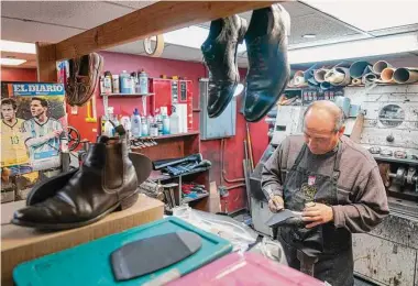  ?? Mary Altaffer/Associated Press ?? An employee repairs women’s shoes at the Alpha Shoe Repair Corp. last month in New York.