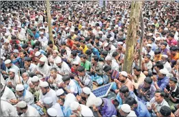  ?? AP/PTI ?? Rohingya refugees pray during a gathering to commemorat­e first anniversar­y of Myanmar army’s crackdown which lead a mass exodus of Rohingya Muslims to Bangladesh