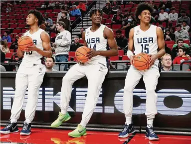  ?? Steph Chambers/Getty Images ?? From left, Whitmore, Jarace Walker (who would play a season for the University of Houston) and Dillon Mitchell were members of Team USA’s under-18 squad in 2022.