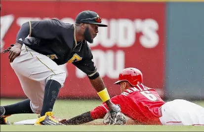  ?? Gary Landers/Associated Press ?? Cincinnati speedster Billy Hamilton steals second base under the tag of Josh Harrison in the fourth inning Thursday at Great American Ball Park in Cincinnati. Hamilton stole six bases in the Reds’ three-game sweep.