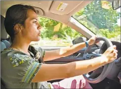  ??  ?? Baltimore Sun intern Giana Han drives to BWI airport after picking up her car in a parking garage near the convention center.