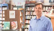  ?? ELORA LEE HENNESSEY, UWM PHOTO SERVICES ?? Novelist Liam Callanan stands in Boswell Books, which gets a sly shout-out in his new novel, "Paris by the Book."