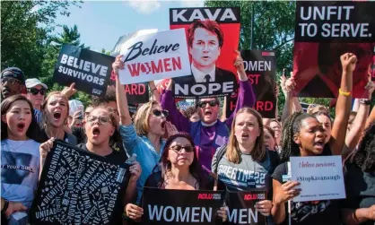  ?? Photograph: Jim Watson/AFP/Getty Images ?? Protesters against Brett Kavanaugh’s nomination to the supreme court in Washington DC. Donald Trump said: ‘It’s a very scary time foryoung men in America when you can be guilty of something that you may not be guilty of.’