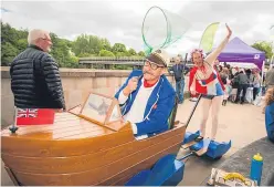  ?? Pictures: Steve MacDougall. ?? Fun at Boating on the Tay, clockwise from top: the makeshift beach in Tay Street; Hanna Akel, threeyear-old daughter Phoebe and wife Gemma Akel, from Dunfermlin­e; a performer from Showboat Circus and a celebratio­n of boat trips along the Tay.