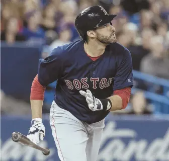  ?? AP PHOtO ?? NEAR MISS: J.D. Martinez watches his long drive hit off the top of the wall for a double during the Red Sox’ 5-3 loss in 12 innings to the Blue Jays last night.