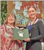  ?? ?? At the Northwest District Project Achievemen­t competitio­n, Lori Bledsoe gives out awards to Floyd County 4-H’ers (From Left) Madison Wood, 1st place in Housing; Sara Grace Abernathy, 1st place in Performing Arts — Dance; and Joe Rutledge, 1st place in Physical, Biological & Earth Science