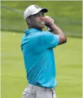  ?? DARRON CUMMINGS/ASSOCIATED PRESS ?? Tiger Woods hits from the fifth fairway during the first round of the Memorial tournament Thursday in Dublin, Ohio.