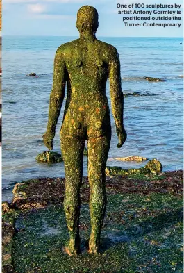  ??  ?? One of 100 sculptures by artist Antony Gormley is positioned outside the Turner Contempora­ry