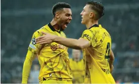  ?? ?? Felix Nmecha celebrates scoring the winner for Borussia Dortmund with Nico Schlotterb­eck. Photograph: Richard Sellers/Getty Images/Allstar