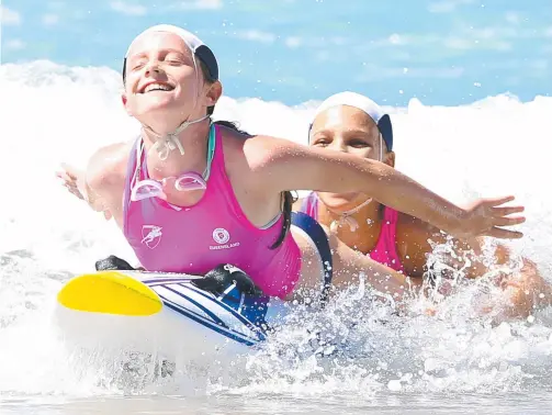  ??  ?? Paige Jones and Edie Hemson compete in the U-12 board rescue finals at the championsh­ips. Pictures: RICHARD GOSLING