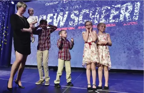  ?? FRANK GUNN/THE CANADIAN PRESS ?? Andrew Scheer’s wife, Jill, holds daughter Mary as Thomas, 12, Henry, 6, Grace, 10, and Madeline, 8, celebrate their father’s victory..