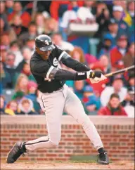  ?? Associated Press file photo ?? Michael Jordan follows through on an RBI double against the Chicago Cubs in 1994 in Chicago.