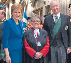  ??  ?? New Moderator Rev Susan Brown when she was elected to office, pictured with the Duke of Buccleuch and Nicola Sturgeon