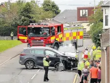  ??  ?? Crash Emergency services attend the scene of the incident in Rattray