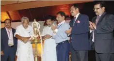  ??  ?? Oomen Chandy, Chief Minister of Kerala along with other dignitarie­s, at the lamp lighting ceremony