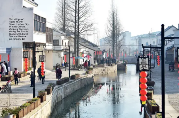 ??  ?? The village of Yigao in Zhili Town, Huzhou City of east China’s Zhejiang Province, during the Fourth Gucheng Cultural Tourism Festival on January 13