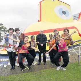  ?? Andrew Price ?? ● Cavern Club and the Sai Mayur dancers at Liverpool Airport to announce their appearance at Llanfes