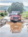  ??  ?? Even a Land Rover struggled to make it along a flooded road near Grinton, North Yorkshire, following this week’s very heavy rain in the region.