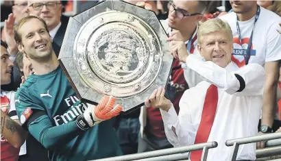  ?? Picture: EPA ?? RED-LETTER DAY. Arsenal manager Arsene Wenger and goalkeeper Petr Cech hold up the Community Shield after beating Chelsea on penalties at Wembley on Sunday.