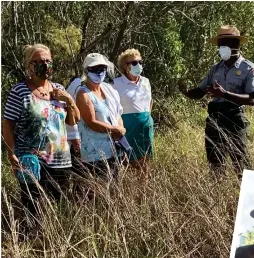  ??  ?? Mainella (second from right) participat­es in a tour group at Everglades National Park.