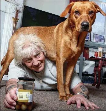  ??  ?? Lucky escape: Alan Spencer, 67, with 18-month-old Lexi and the offending jar of onions