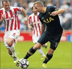  ?? Picture: REUTERS ?? FLEET-FOOTED: Tottenham Hotspur’s Harry Kane, right, in action with Stoke City’s Glenn Whelan at the weekend when Kane scored in Spurs’ victory.