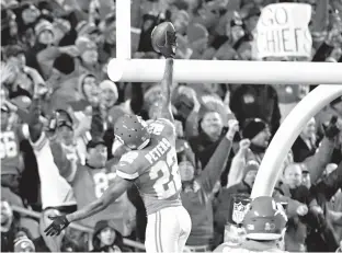  ?? Associated Press ?? Kansas City Chiefs defensive back Marcus Peters (22) celebrates his touchdown after he stripped the ball from Denver Broncos running back Jamaal Charles (28), during the first half of an NFL football game Monday in Kansas City, Mo. Peters recovered the...