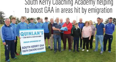 ??  ?? Sean Farley (front centre) and Brian Quinlan on the right presenting South Kerry Board Chairman Michael Keating with new training tops for the South Kerry Coaching Academy, pictured with academy members and board representa­tives.
