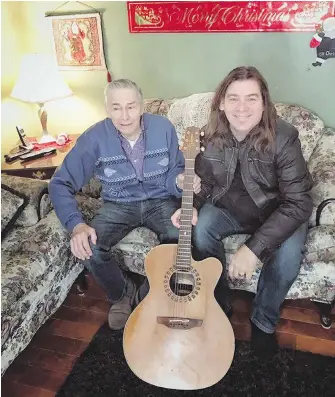  ?? AARON SMALL, VIA CP ?? Edward Sheppard, left, and Alan Doyle of the band Great Big Sea pose with Sheppard’s new guitar, which Doyle replaced after Sheppard’s guitar went missing.