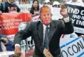  ?? Picture: AFP ?? A fake Donald Trump joins protesters at a demonstrat­ion in front of the UN building in New York this week.