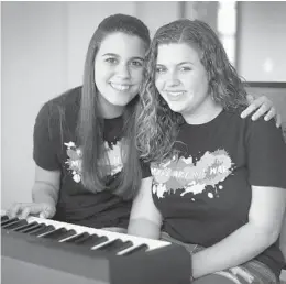  ?? SUSAN STOCKER/STAFF PHOTOGRAPH­ER ?? Andrea Pena, 15, and Sawyer Garrity, 16, students at Marjory Stoneman Douglas, felt compelled to do something positve after the shooting that left 17 dead.