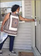  ?? Lori Van Buren / Times Union ?? Luz Marquez Benbow, a census outreach worker from Capital District Latinos, knocks on door Wednesday in Arbor Hill.