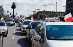  ??  ?? WARSAW: Taxi drivers block the streets of Warsaw to protest against ride sharing app Uber and competitor­s in Warsaw yesterday. Traditiona­l cab operators argue that the app represents unfair competitio­n because Uber drivers can dodge the rules and...