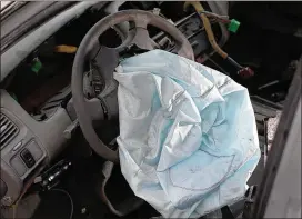  ?? JOE RAEDLE / GETTY IMAGES 2015 ?? A deployed air bag is seen in a 2001 Honda Accord at a salvage yard in Florida. Some 2001, 2002 and 2003 Honda and Acura models are most at risk of air bag rupture when they deploy, Sen. Amy Klobuchar, D-Minn., reiterated in a letter to Honda.
