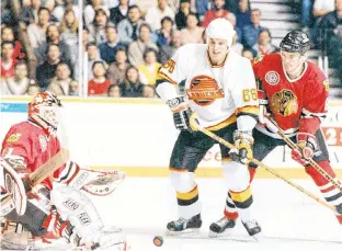  ?? STEVE BOSCH/POSTMEDIA NEWS FILE ?? Vancouver Canucks winger Gino Odjick in his first NHL game, against the Chicago Blackhawks in November 1990.