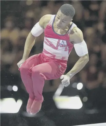  ?? ?? Britain’s Joe Fraser competes to win a gold medal in the men’s parallel bars final