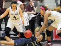  ?? Arkansas Democrat- Gazette/ BENJAMIN KRAIN ?? University of Arkansas at Little Rock’s Kaitlyn Pratt ( right) chases after a loose ball after Georgia Southern University’s Amira Atwater lost her dribble Thursday during the Trojans’ 57- 41 victory over the Eagles at the Jack Stephens Center in...