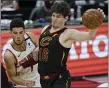  ?? TONY DEJAK — THE ASSOCIATED PRESS ?? Cedi Osman his fouled by the Suns’ Devin Booker in overtime May 4.