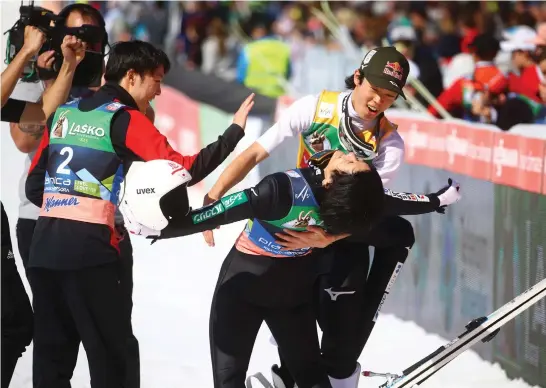  ?? (Borut Zivulovic/Reuters) ?? SKI JUMPING World Cup 2022 in Slovenia this past March, with Japan’s Yukiya Sato and Junshiro Kobayashi reacting after competing in the men’s HS240.