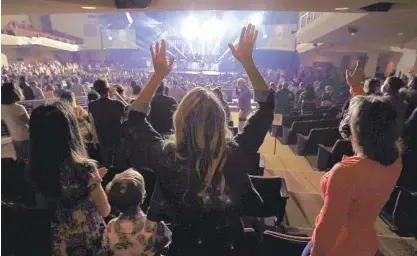 ?? JOHN GASTALDO PHOTOS ?? Leaders at The Rock Church, which has several locations, did not choose to limit capacity for Sunday’s resumption of indoor services, but they instituted several safety precaution­s.