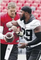  ?? TONY CALDWELL ?? When Ottawa quarterbac­k Trevor Harris, left, has been good this season, he’s been really good, writes Tim Baines.