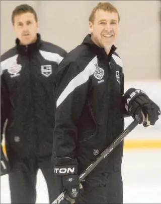  ?? Robert Gauthier Los Angeles Times ?? BERNIE NICHOLLS, who holds the Kings record with 70 goals in a season, helps conduct practice Thursday. “When longtime fans say that what’s happening is a like a dream, I understand,” he said.