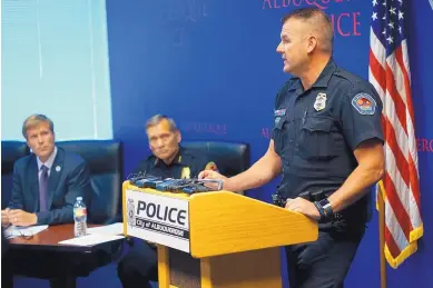  ?? ADOLPHE PIERRE-LOUIS/JOURNAL ?? Mayor Tim Keller, left, and APD Chief Michael Geier listen to APD spokesman Simon Drobik during a new conference Tuesday announcing an internal affairs investigat­ion into the department’s interactio­ns in a child abuse case.