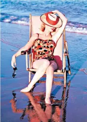  ?? ?? g All decked out: deckchairs give beachgoers a chance to recline and unwind