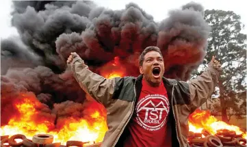  ?? — Reuters photo ?? A member of Brazil’s Homeless Workers Movement (MTST) reacts during a protest against Temer in Sao Paulo, Brazil.