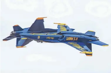  ?? PHOTOS BY ALAN DE HERRERA ?? Blue Angel lead solo pilot Lt. Cmdr. Julius “Whiskers” Bratton dazzles the crowd in the No. 5 jet during his final season as a Blue Angel pilot.