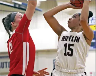  ?? TOM BOLAND — SPECIAL TO THE READING EAGLE ?? Gov. Mifflin’s Gloria Serrano (15) shoots against Wilson’s Erin Shober during the Mustangs’ win over the Bulldogs Saturday.