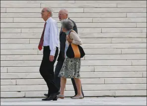  ?? AP/PABLO MARTINEZ MONSIVAIS ?? Retired Supreme Court Justice Anthony Kennedy (left) walks outside the Supreme Court building Tuesday with Justice Stephen Breyer and Breyer’s wife, Joanna Hare. Kennedy attended the court’s session as new Justice Brett Kavanaugh took his place on the bench.