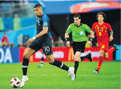  ?? PAUL ELLIS / AFP / GETTY IMAGES ?? French forward Kylian Mbappe, seen in action this week against Belgium, has shown exquisite speed and ball control in the World Cup tournament, and has proven difficult to defend for even experience­d opponents.